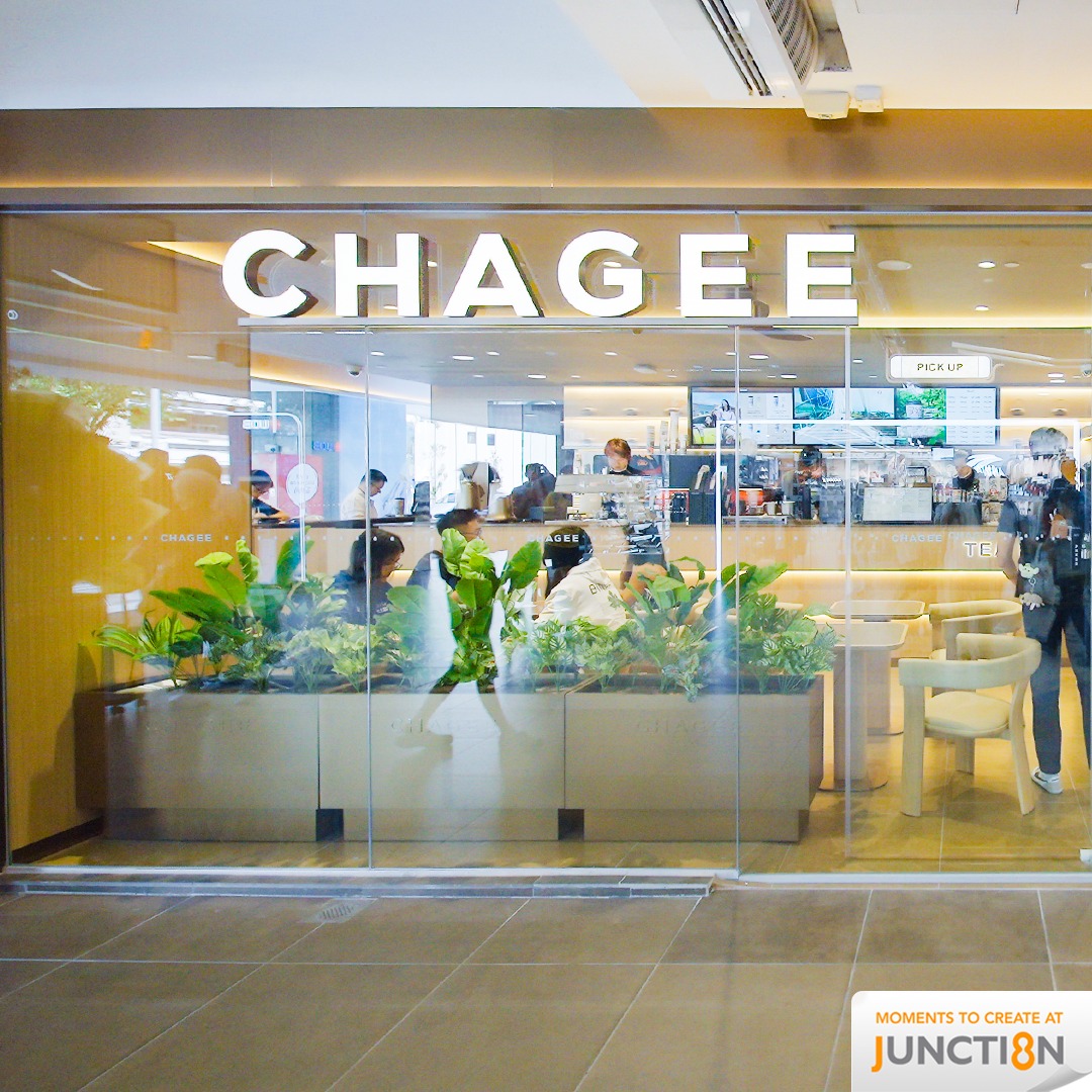 Staff serving customers at Chagee Singapore counter