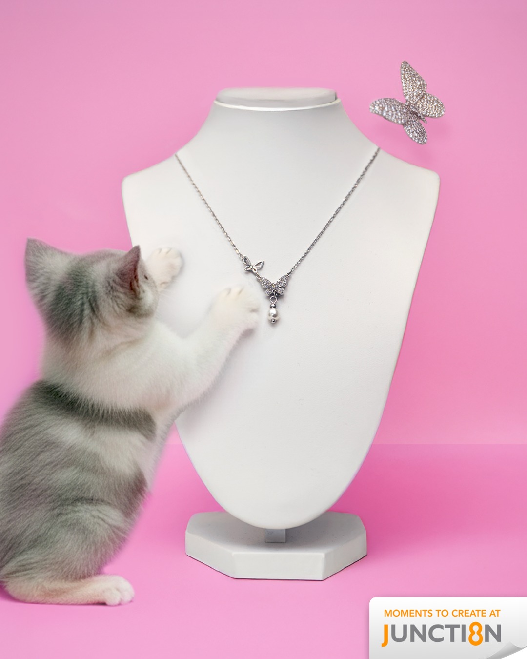 Chomel's butterfly-inspired simulated pearl necklace and cubic zirconia brooch