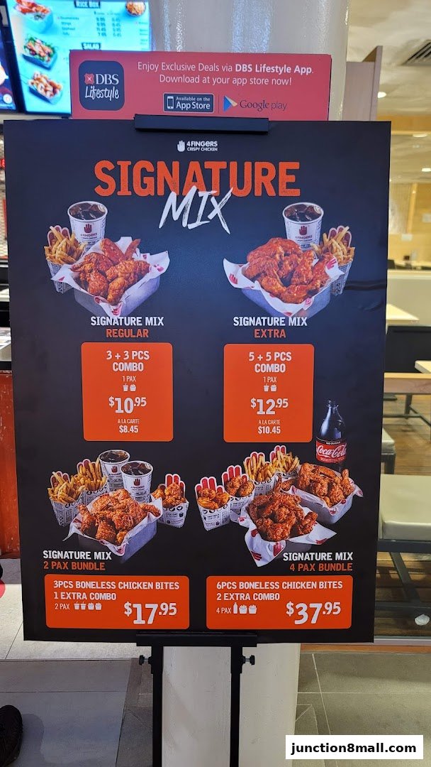 A menu board for 4 Fingers Crispy Chicken showcasing their Signature Mix combos and bundles.