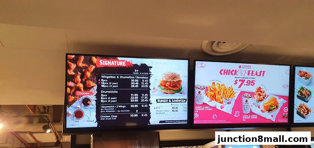 Digital menu boards displaying crispy chicken options, combos, and burgers.