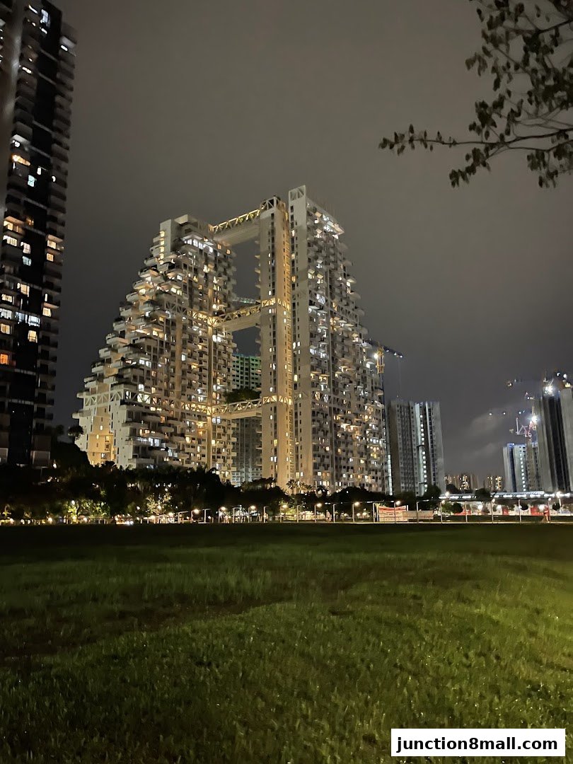 A striking, illuminated architectural complex at night, set against a dark sky.