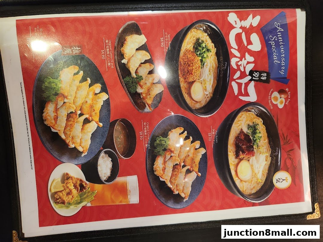 A menu featuring various ramen dishes and gyoza, with prices and descriptions.