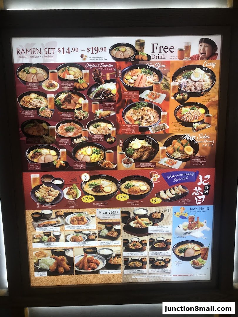 A menu board displaying various ramen sets, rice sets, and other Japanese dishes with prices.