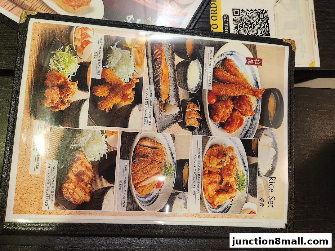 A menu from Ajisen Ramen featuring various Japanese dishes with prices and descriptions.