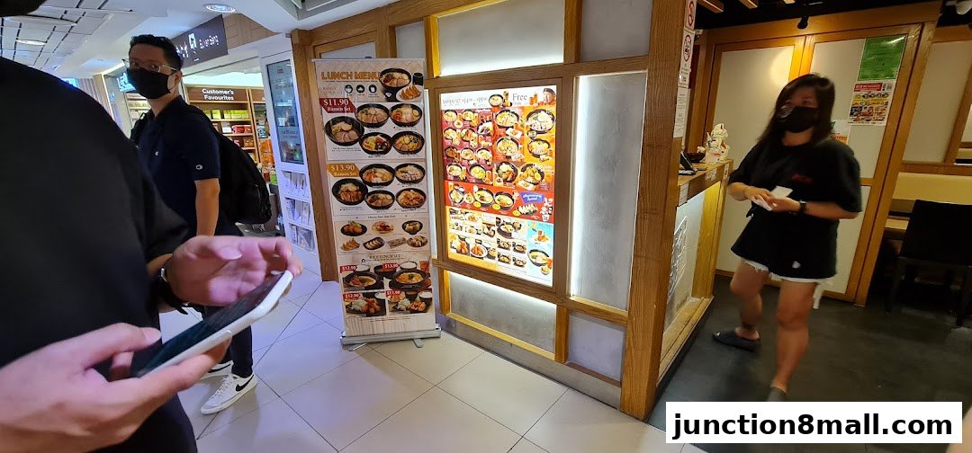 Ajisen Ramen shop with a lunch menu displayed outside.