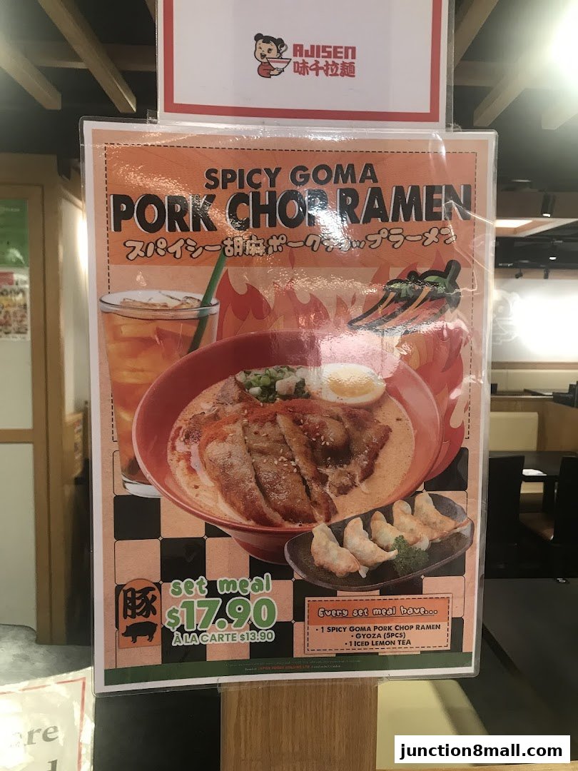 A menu poster for Ajisen Ramen featuring their Spicy Goma Pork Chop Ramen set meal.