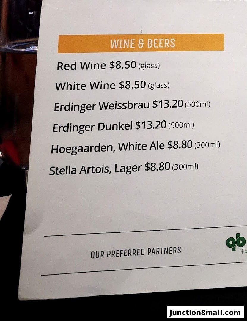 A menu section displaying various wines and beers with prices.