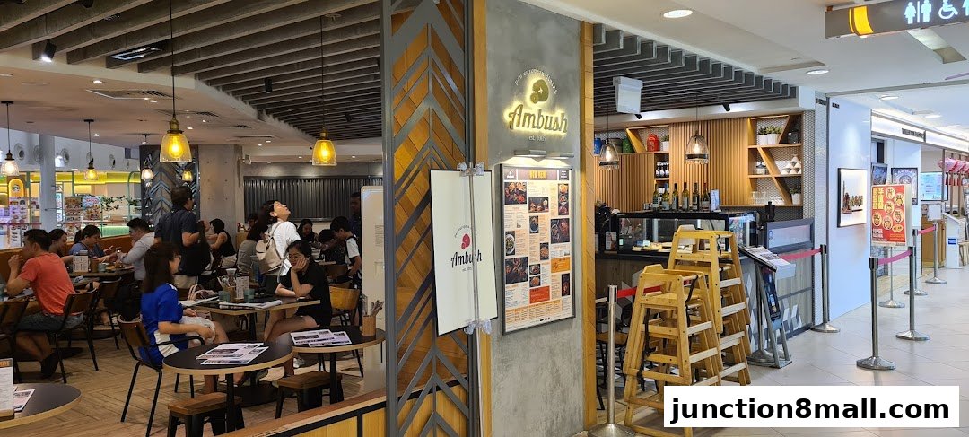 Interior view of Ambush restaurant with diners and a visible menu board.
