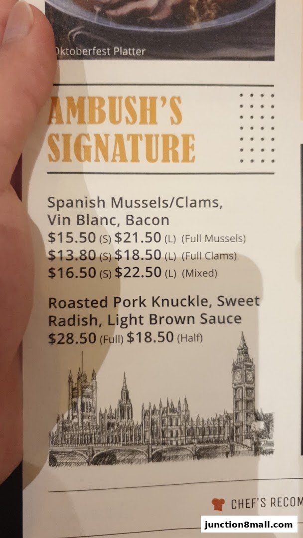 A menu page from Ambush featuring signature dishes like Spanish Mussels and Roasted Pork Knuckle.