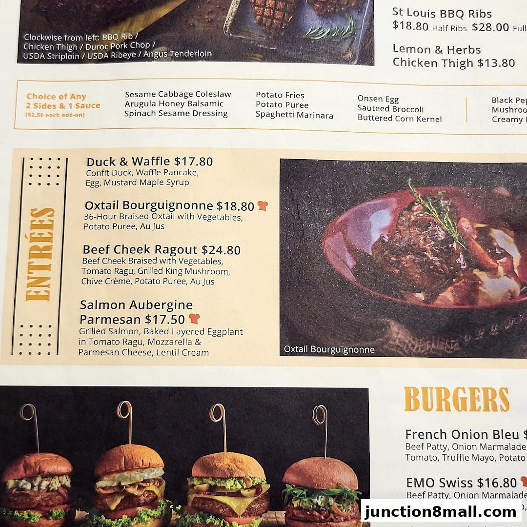 A menu featuring entrees like Duck & Waffle, Oxtail Bourguignonne, Beef Cheek Ragout, and Salmon Aubergine Parmesan.