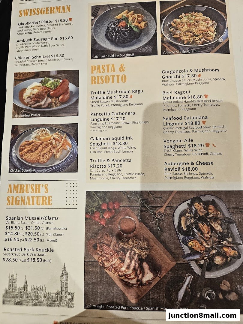 A menu featuring Swiss German, Pasta & Risotto, and Signature dishes with accompanying food images.