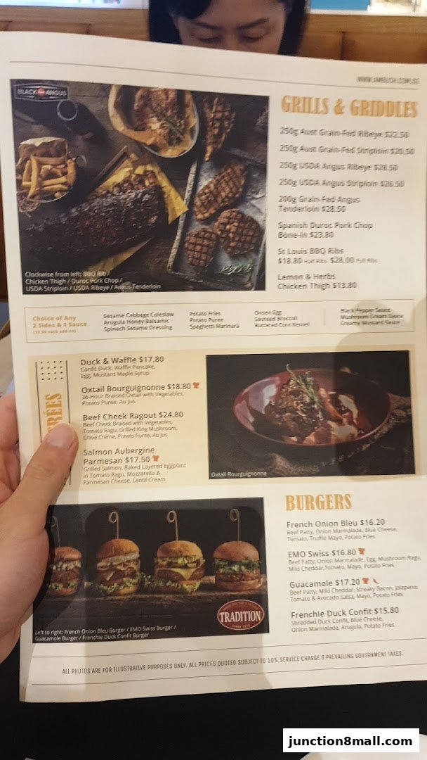 A menu from Ambush restaurant featuring grills, burgers, and entrees with accompanying food images.