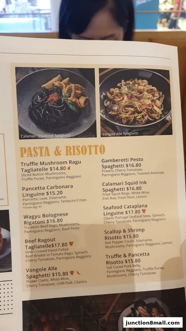 A menu featuring pasta and risotto dishes with enticing descriptions and prices.