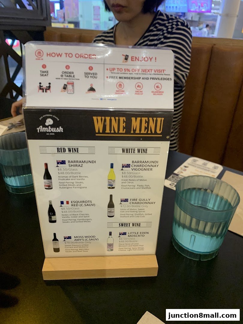 A wine menu from Ambush restaurant with red, white, and sweet wine selections.