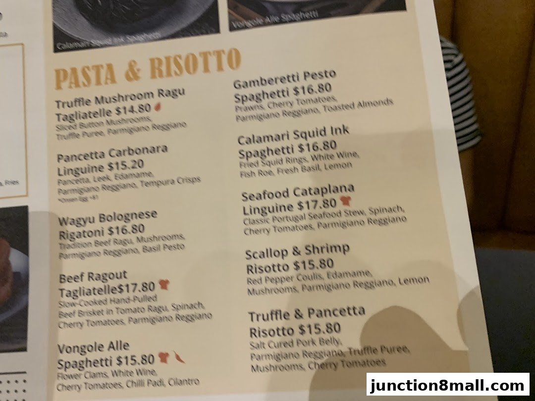 A menu featuring pasta and risotto dishes with detailed descriptions and prices.