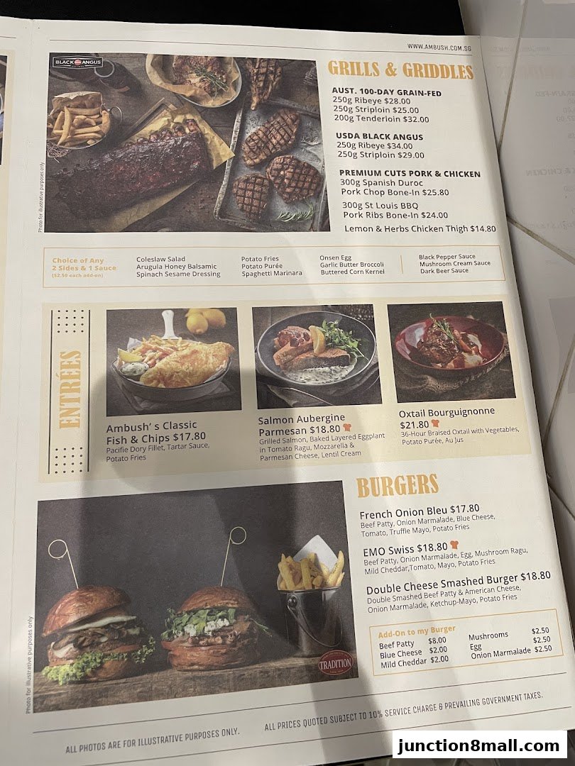 A menu from Ambush restaurant featuring grilled meats, fish and chips, salmon, oxtail, and burgers.