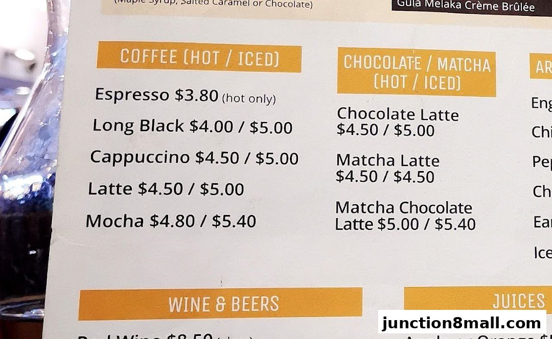 A menu featuring coffee, chocolate, matcha, wine, and beer options with prices.