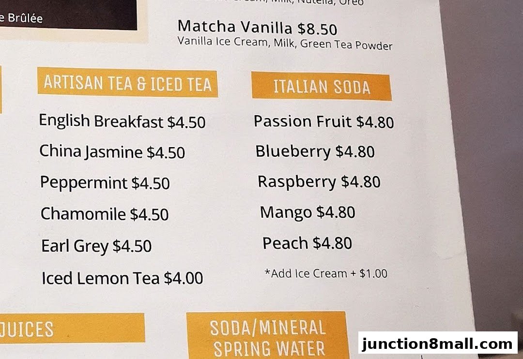 A menu featuring Artisan Teas, Iced Teas, Italian Sodas, and other beverages.