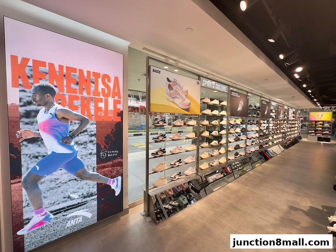 Interior view of an Anta sports shoe store showcasing a wide selection of footwear on display.