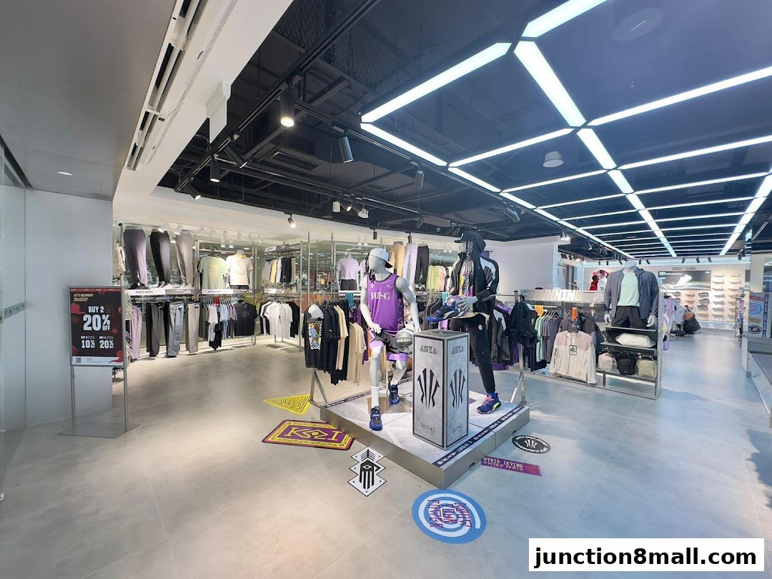 Interior view of an Anta sports apparel store with clothing displays and mannequins.