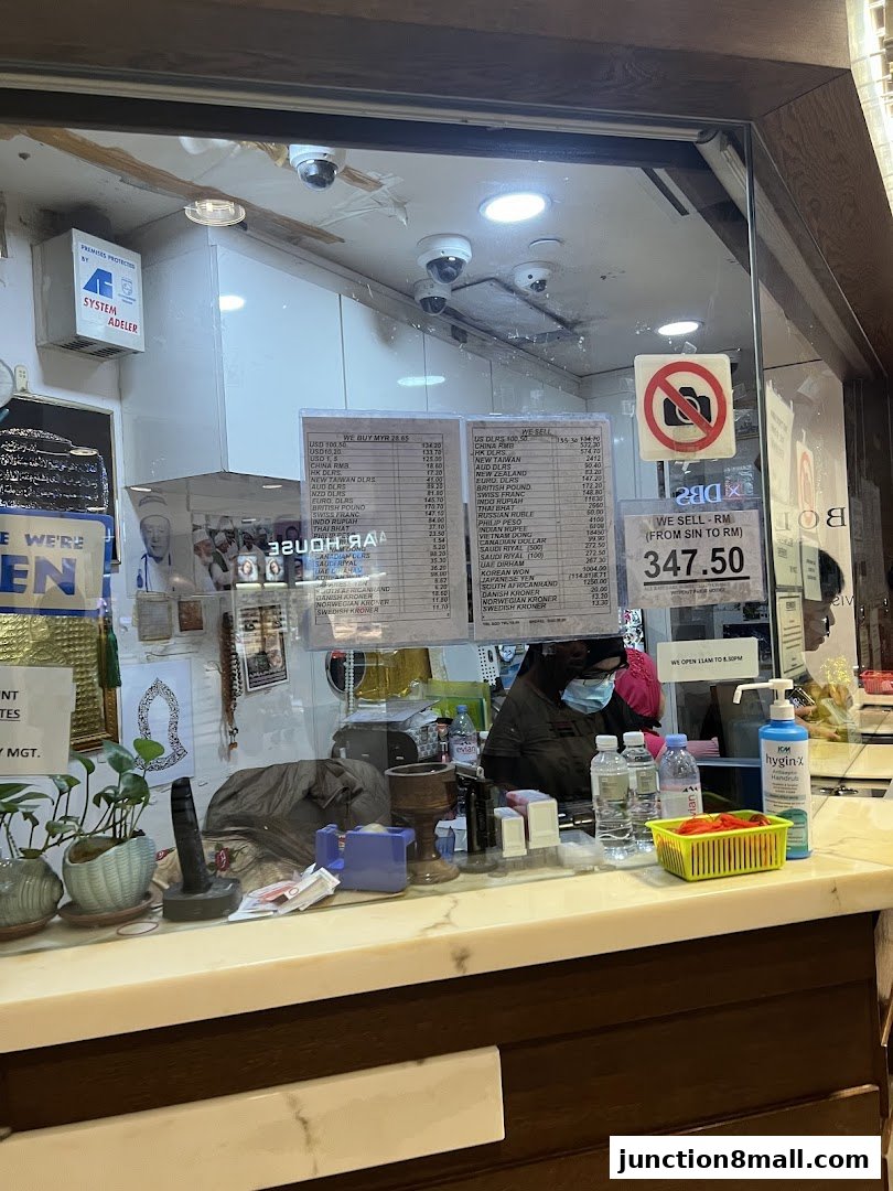 Interior view of an AR Money Exchange shop with currency exchange rates displayed.