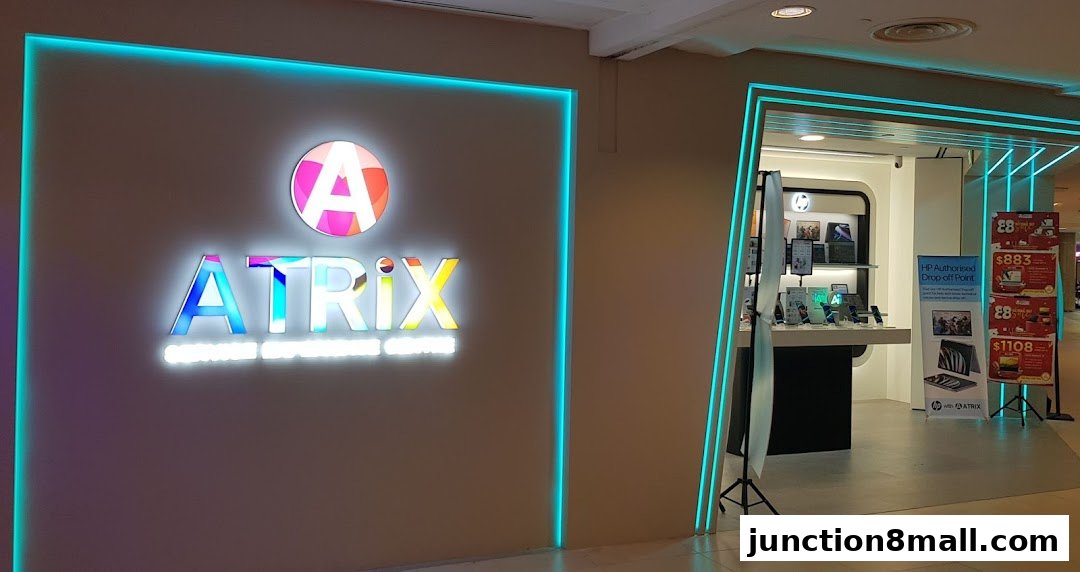 The exterior of the ATRiX Official Store, featuring a prominent illuminated logo and product displays.