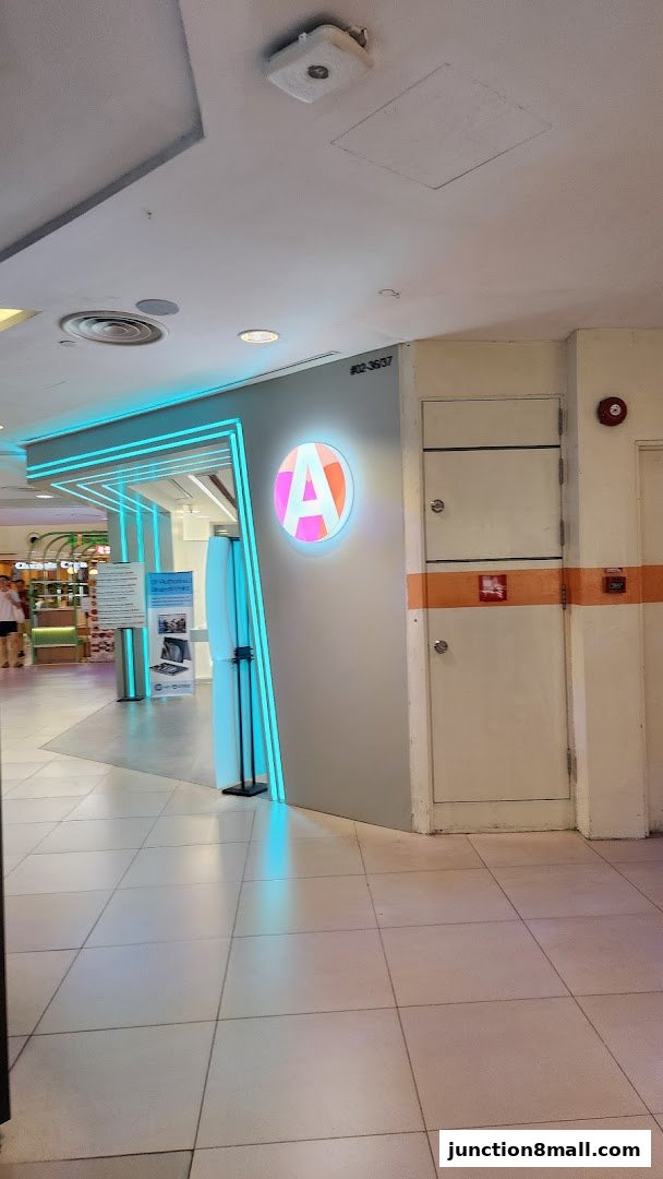 The entrance to ATRiX Official Store with a prominent circular logo and neon blue accents.