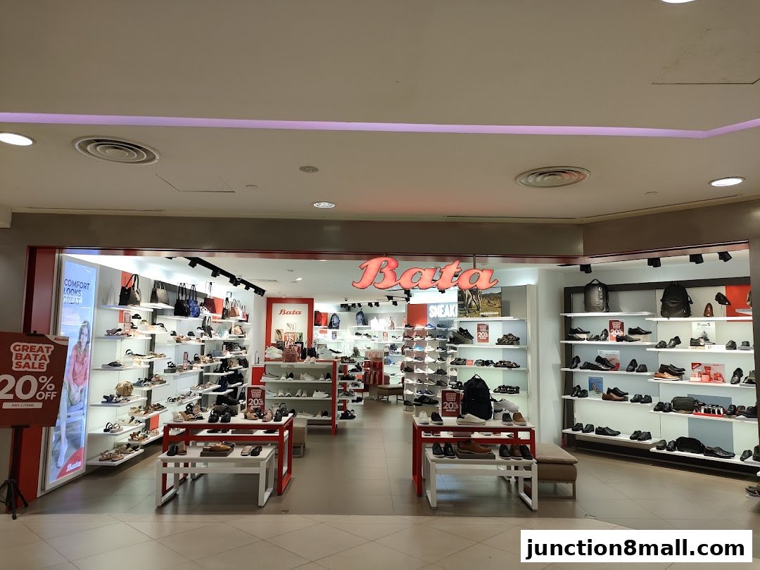 Interior view of a Bata shoe store showcasing a wide variety of footwear and bags.