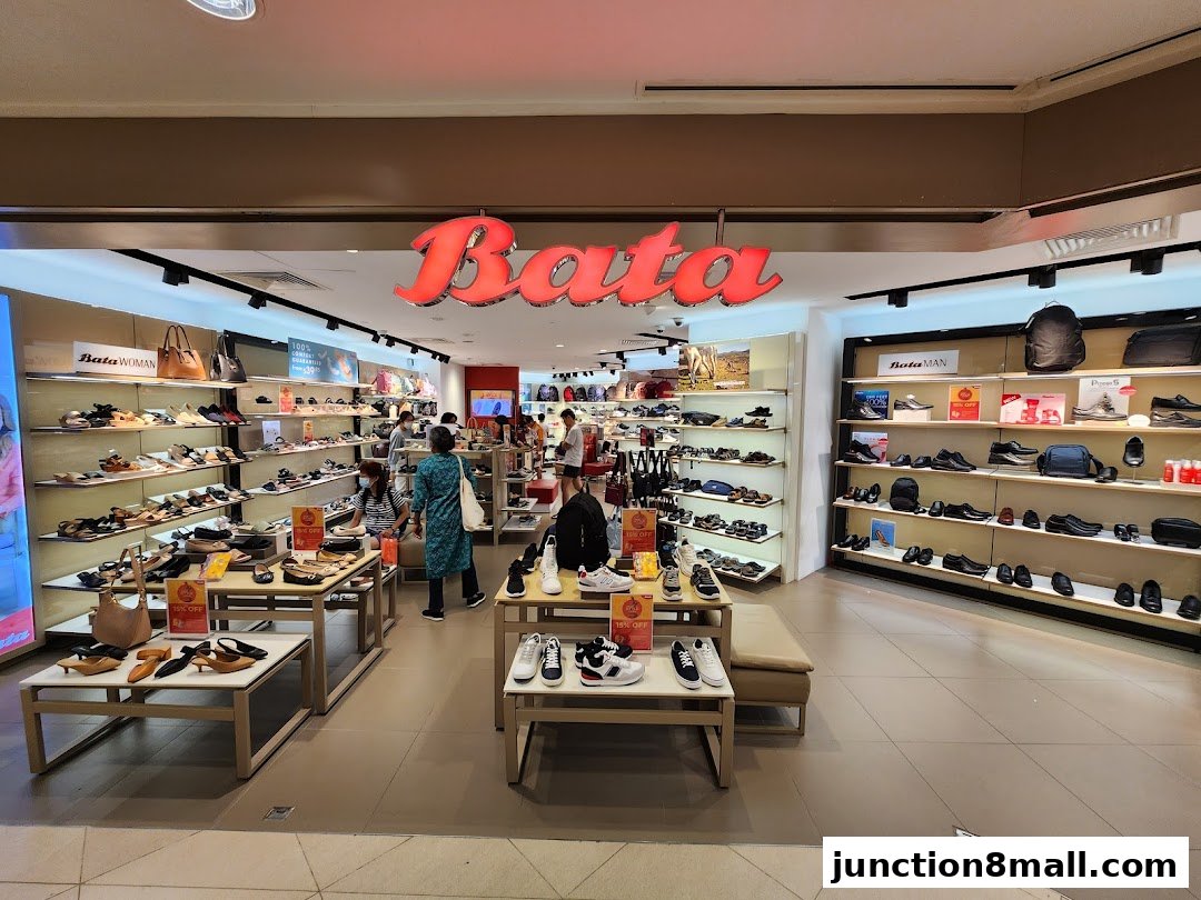 Interior view of a Bata shoe store showcasing a wide variety of footwear for men and women.