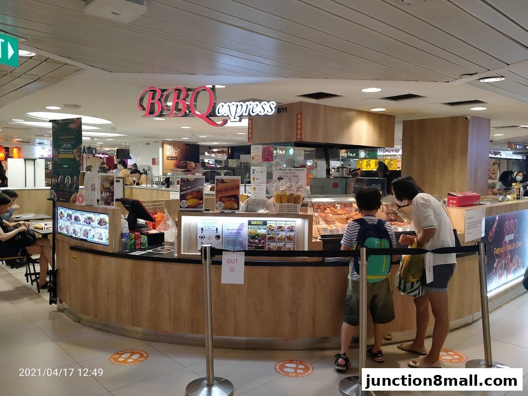 A family browses the food display at BBQ Express, a casual dining spot.