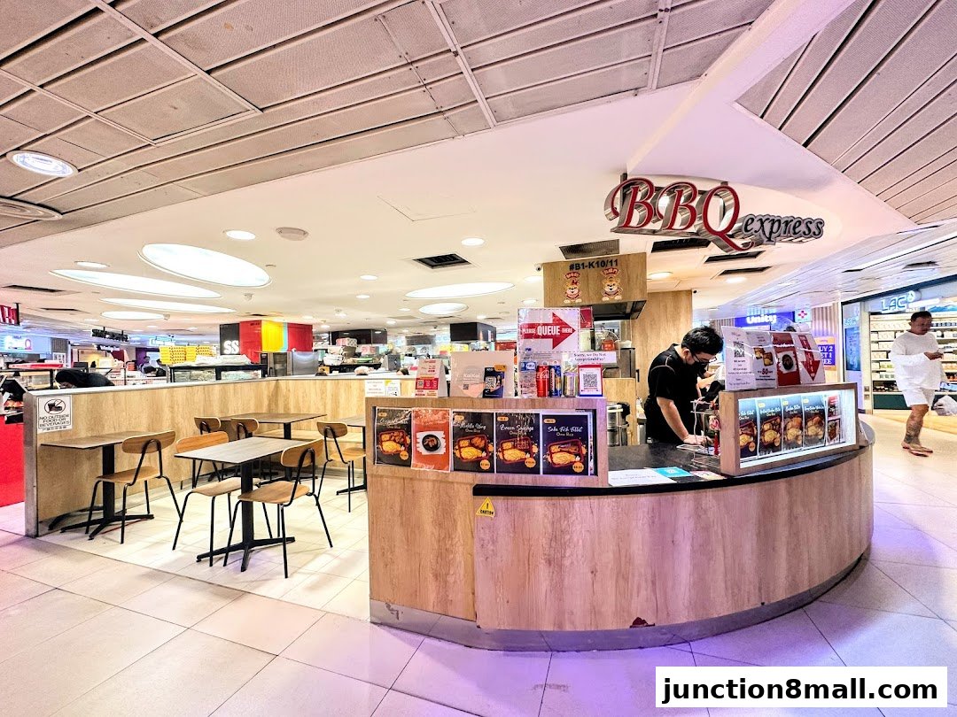 BBQ Express shop counter with seating area and staff preparing food.