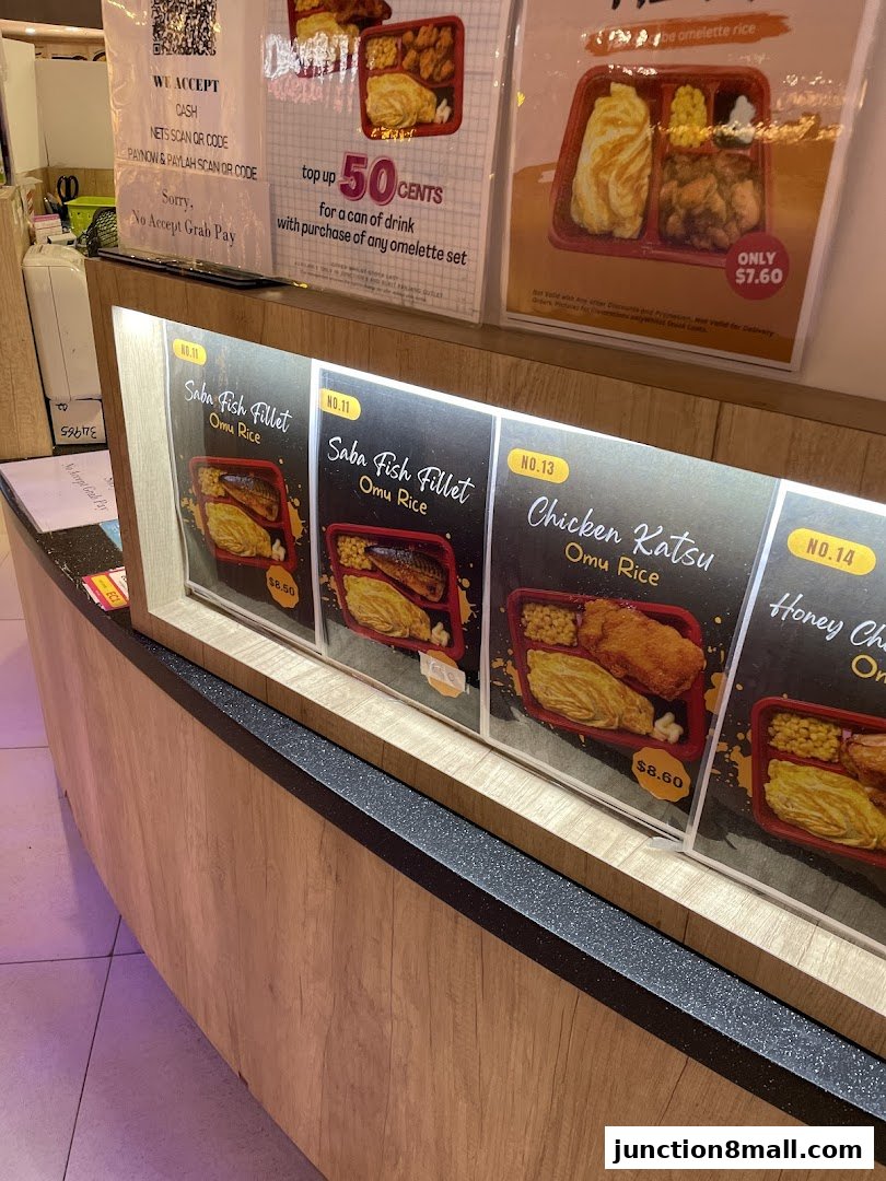 A display of various Omu Rice meal sets with prices and descriptions.