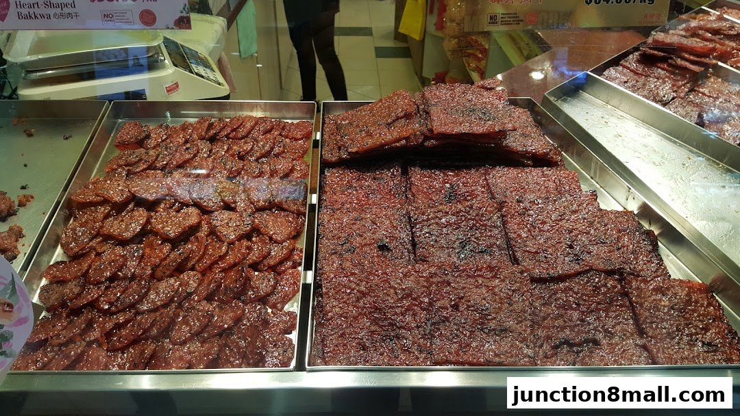 A display of freshly made bak kwa, a popular dried meat snack, in various shapes and sizes.