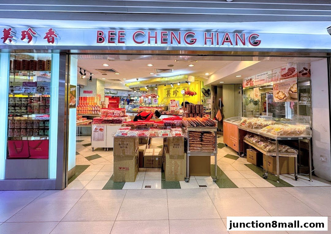 The entrance of Bee Cheng Hiang, a shop selling various food products, with displays of snacks and gift items.