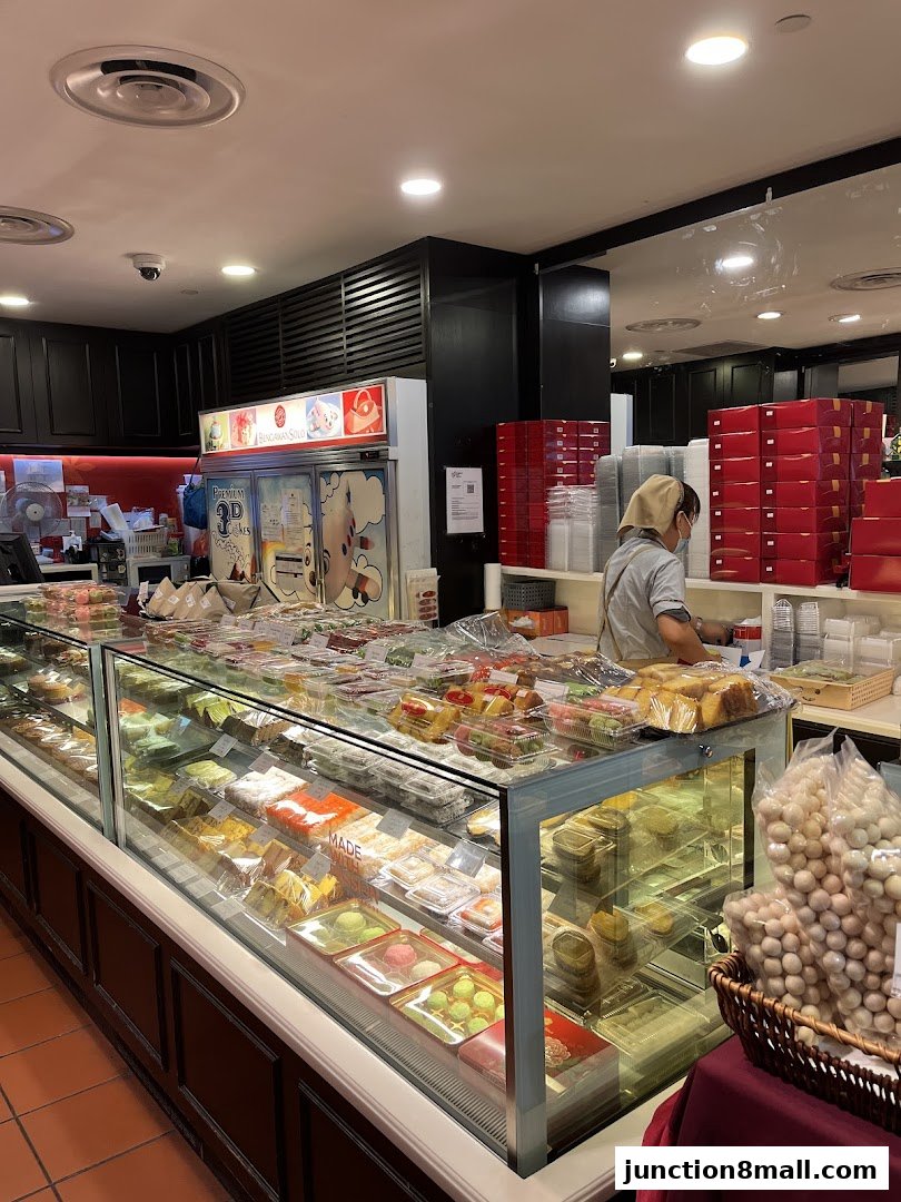 A display case filled with various pastries and desserts at Bengawan Solo.