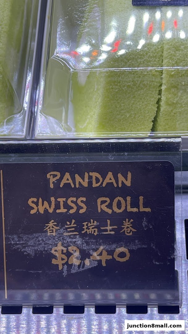 A close-up of a Pandan Swiss Roll with its price displayed.