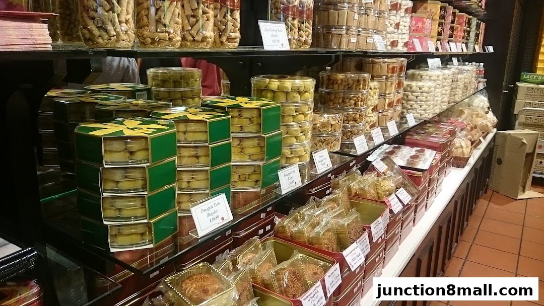 A display of various cookies and pastries in clear containers and decorative boxes.