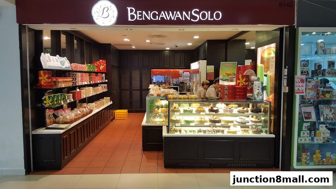 A bakery shop called Bengawan Solo displaying cakes and packaged snacks.