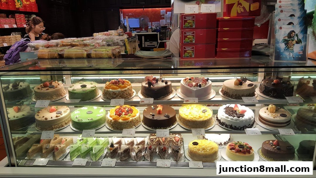 A display case filled with various cakes and pastries at Bengawan Solo.