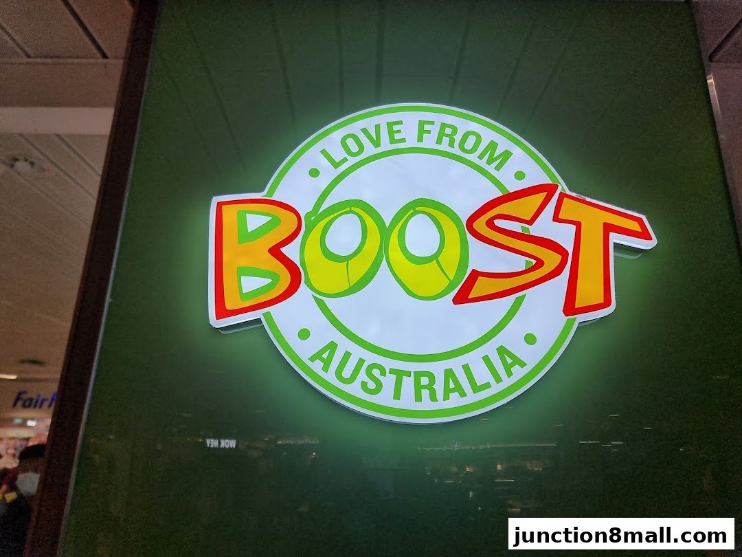 A glowing sign for Boost Juice, featuring the brand's logo and 'Love from Australia'.