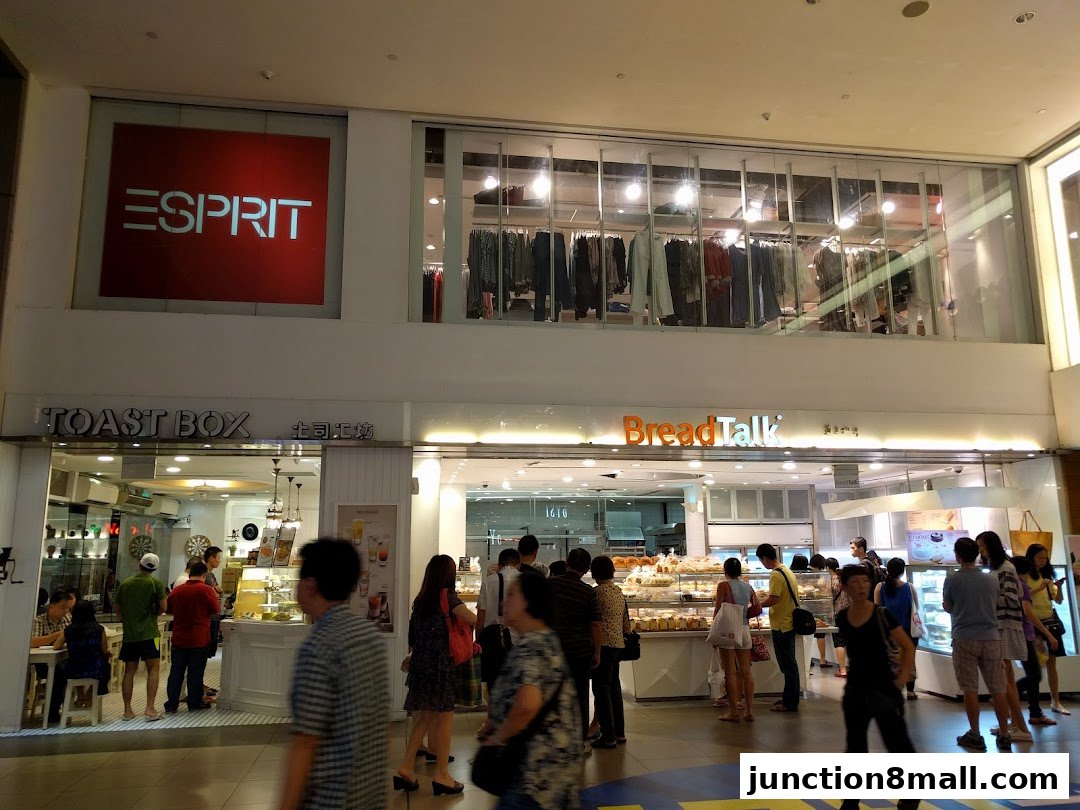 People are seen queuing at BreadTalk and Toast Box, with Esprit signage above.