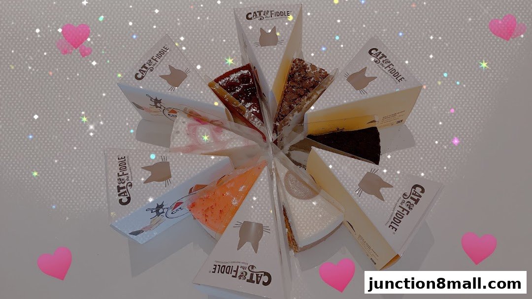 A variety of cheesecakes are displayed in a circular arrangement with branded packaging.