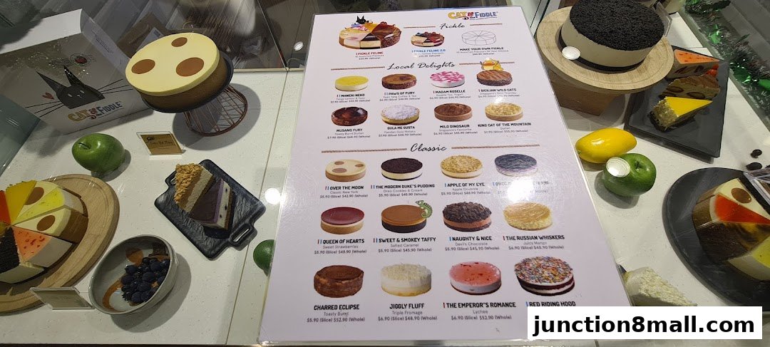 A display of various cakes and their descriptions with prices from Cat the Fiddle.