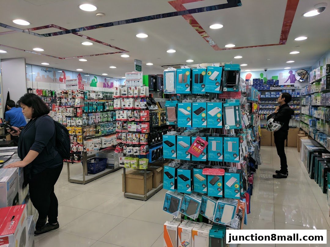 Interior view of a Challenger store showcasing mobile accessories and electronics.