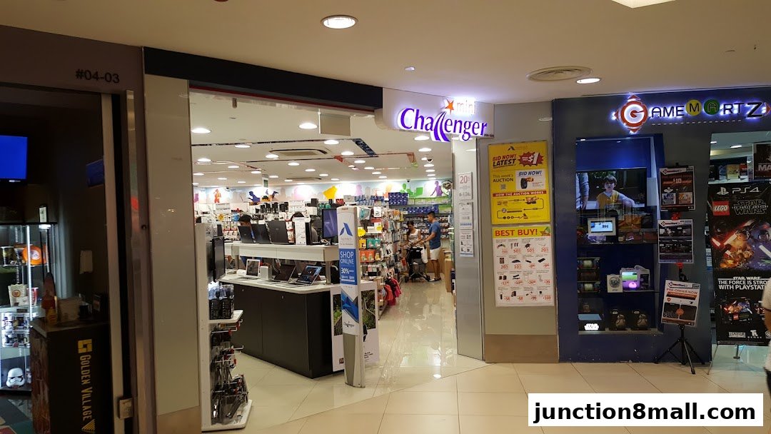 The entrance to Challenger and Game Mart Z electronics stores, showcasing various products and promotions.