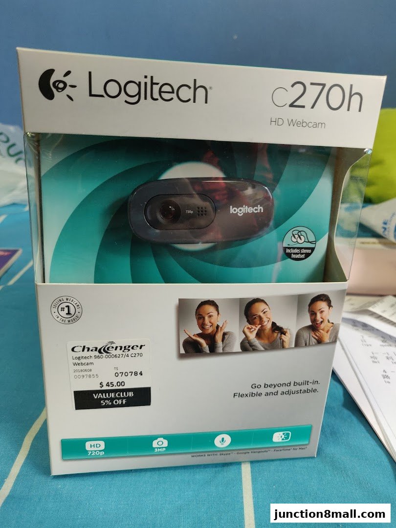 A Logitech C270h HD Webcam in its retail packaging with pricing and discount information.