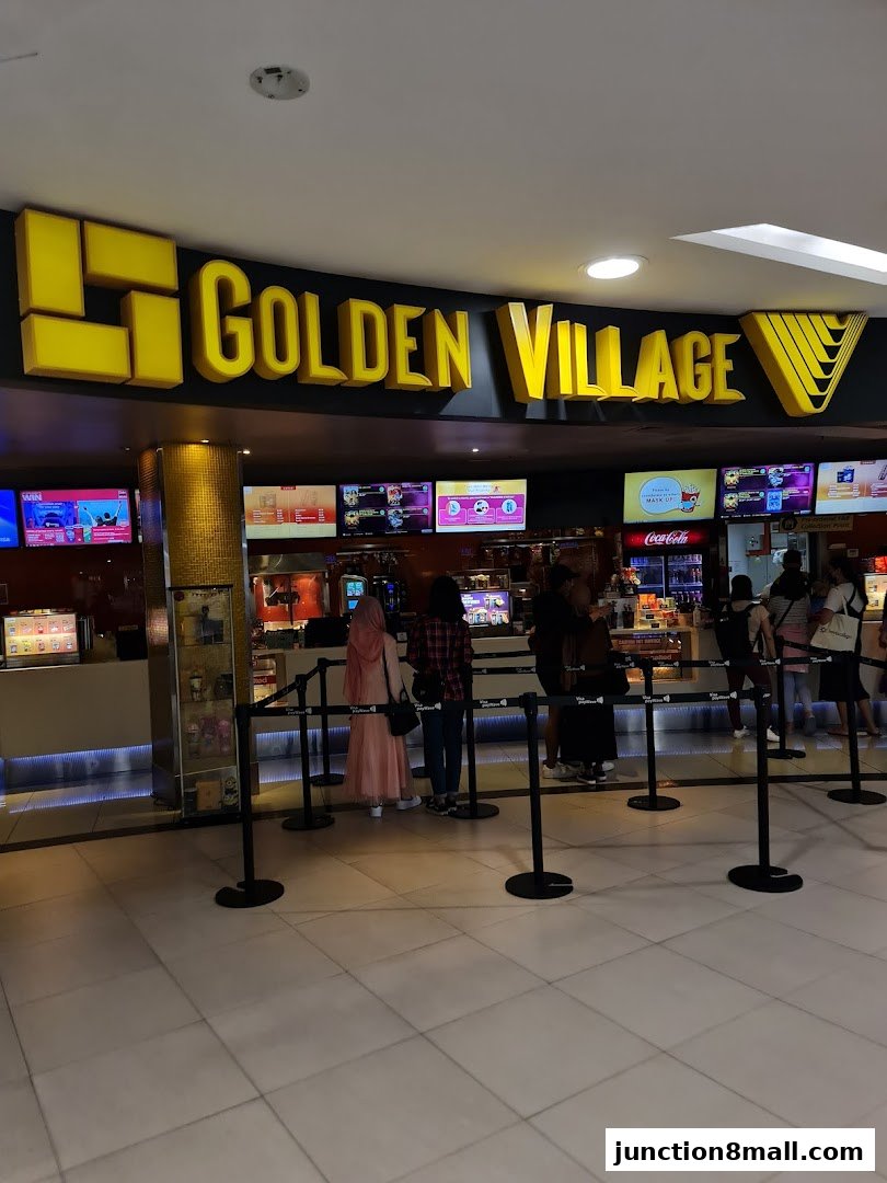 The entrance of Golden Village cinema with a queue of people waiting.