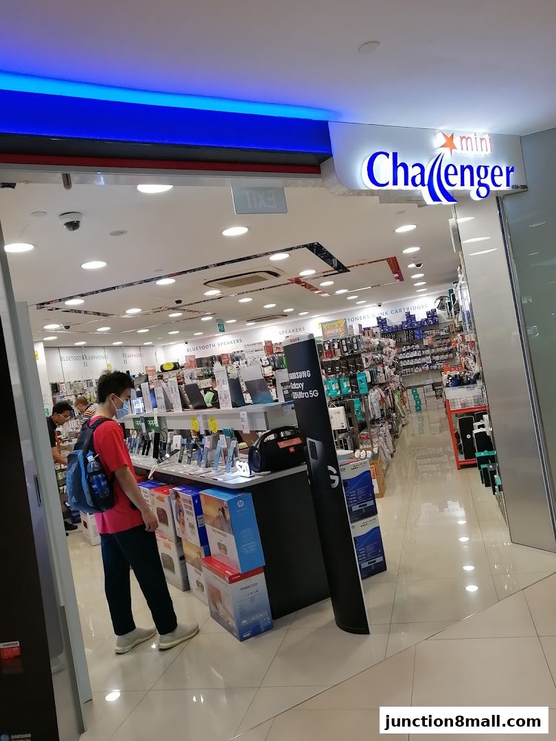 Entrance to Challenger MOBILE Junction 8 electronics store with various gadgets on display.
