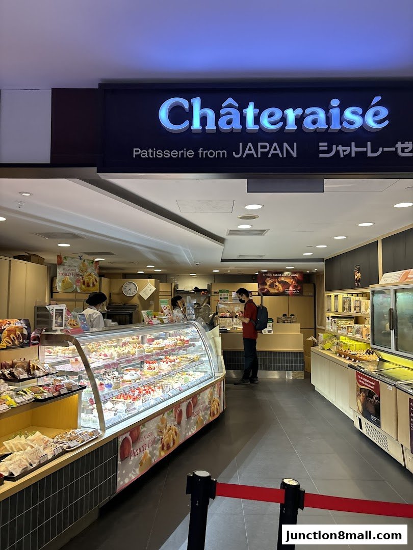 Interior view of a Châteraisé patisserie shop with a display of cakes and pastries.