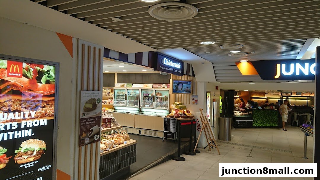 A view of the Châteraisé patisserie shop with display refrigerators and baked goods.